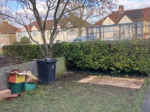 Post builders rubbish removal, revealing a clean and decluttered lawn in West Wickham