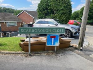 Rubbish Removal Biggin Hill - Cardboard waste collection at Scarborough Close street sign