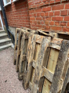 Old pallets awaiting rubbish removal on Queensthorpe Road, Sydenham SE26 by Junk Guy