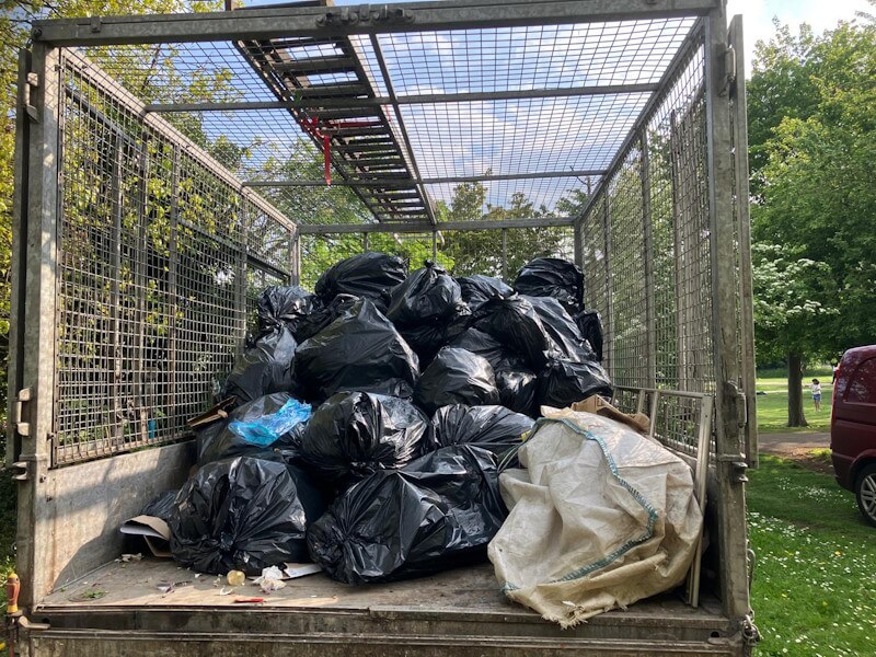 Junk Guy rubbish removal truck fully loaded with black bags and commercial waste from Central Park, Dartford DA1 1JB