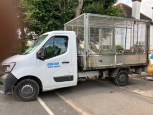 Professional rubbish removal in progress on Crichton Road, Carshalton SM5 - Junk Guy team loading waste materials