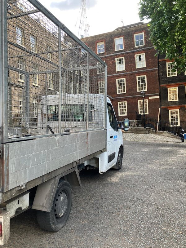 Junk Guy rubbish removal truck on location providing waste collection services in City of London