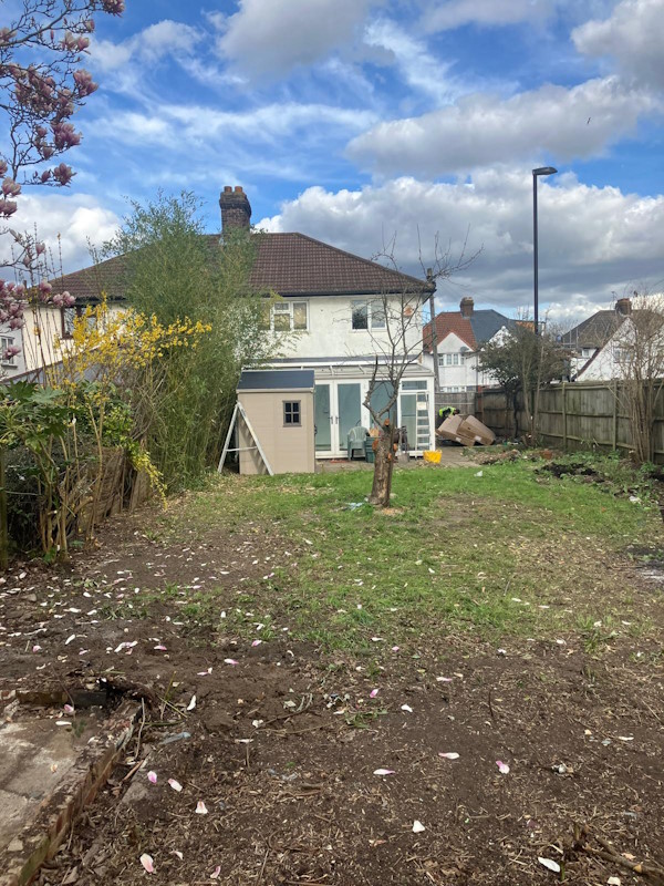 Garden clearance Bromley residential property showing cleared lawn area and garden waste removal