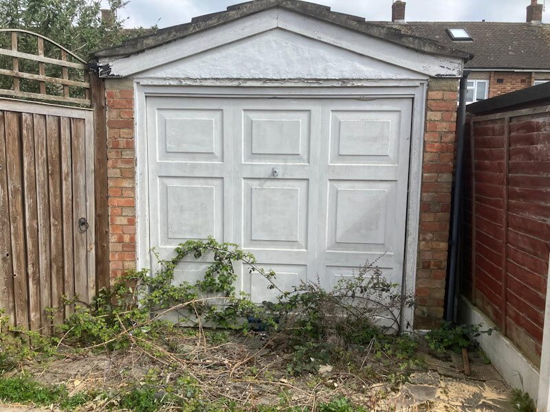 Professional brick garage removal service showing complete demolition and site clearance in London