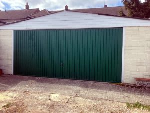Double garage demolition project showing large structure dismantling by certified demolition contractors