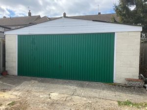 Double garage removal service showing large garage demolition and clearance work