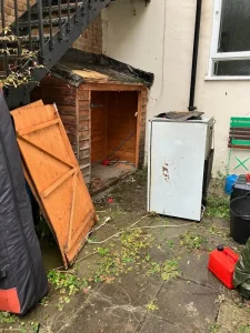 Final stages of shed removal showing cleared Islington backyard space ready for new use