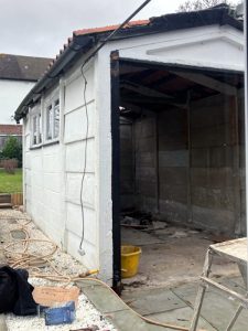 Garage demolition process showing step-by-step structural dismantling methodology