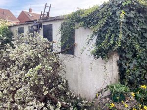 Completed garage demolition in The Rodings Upminster showing clean site restoration