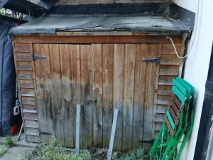 Weathered wooden shed in Islington backyard before professional removal assessment