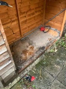 Empty shed interior during professional removal process in Islington North London