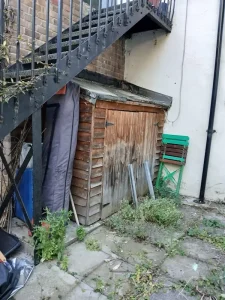 Shed removal in progress at Islington N5 property showing professional dismantling service