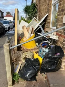 Construction waste and household rubbish piled outside residential property in Croydon requiring professional removal service