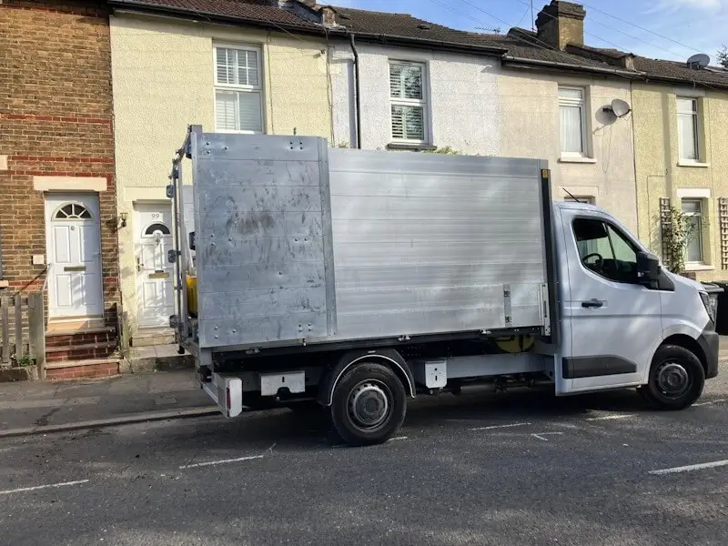 JunkGuy rubbish removal service truck parked on residential street in Croydon ready for waste collection