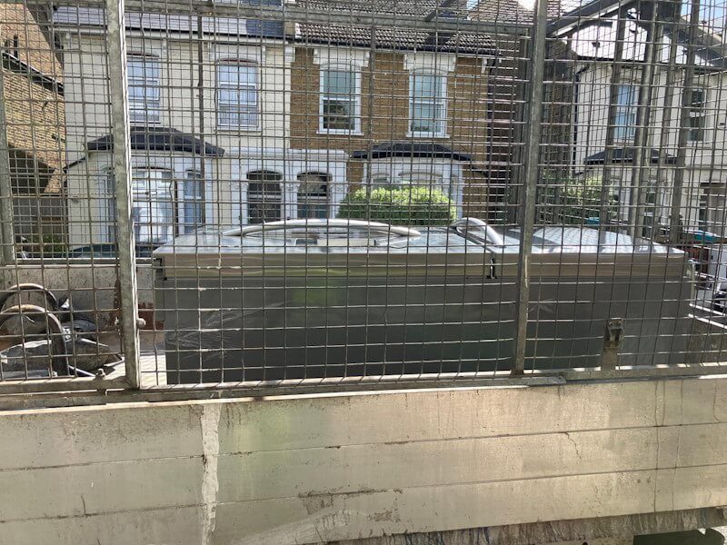 Fridge freezer removal from home garage in London - professional appliance disposal by Junk Guy®