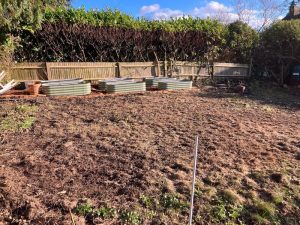 Garden debris and waste being loaded for removal in Pembury, Kent TN2