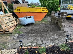 Professional waste removal truck loaded with garden waste and green debris in Pembury, Kent TN2
