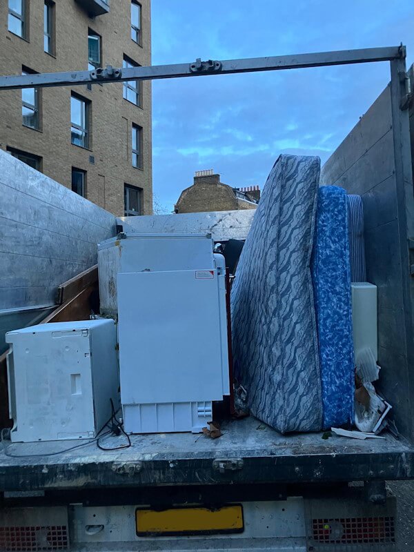 Junk Guy® truck loaded with mattresses and white goods — bulky item removal Elephant and Castle SE1