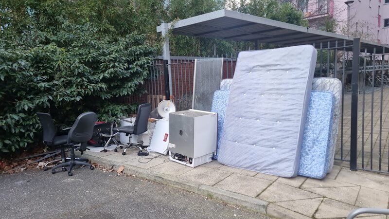 Mixed bulky waste including office chairs and mattresses outside residential estate — rubbish removal SE1 Elephant and Castle
