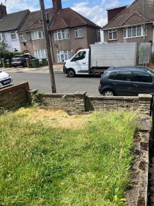 Two-man Junk Guy team carrying furniture and rubble on Shooter's Hill SE18